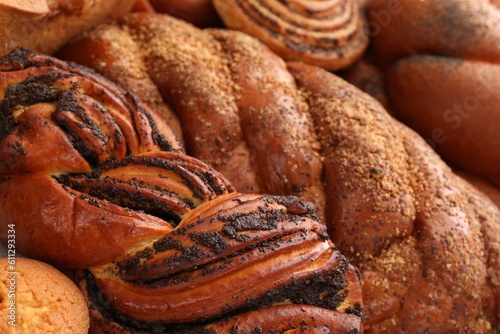 Different tasty freshly baked pastries as background, closeup