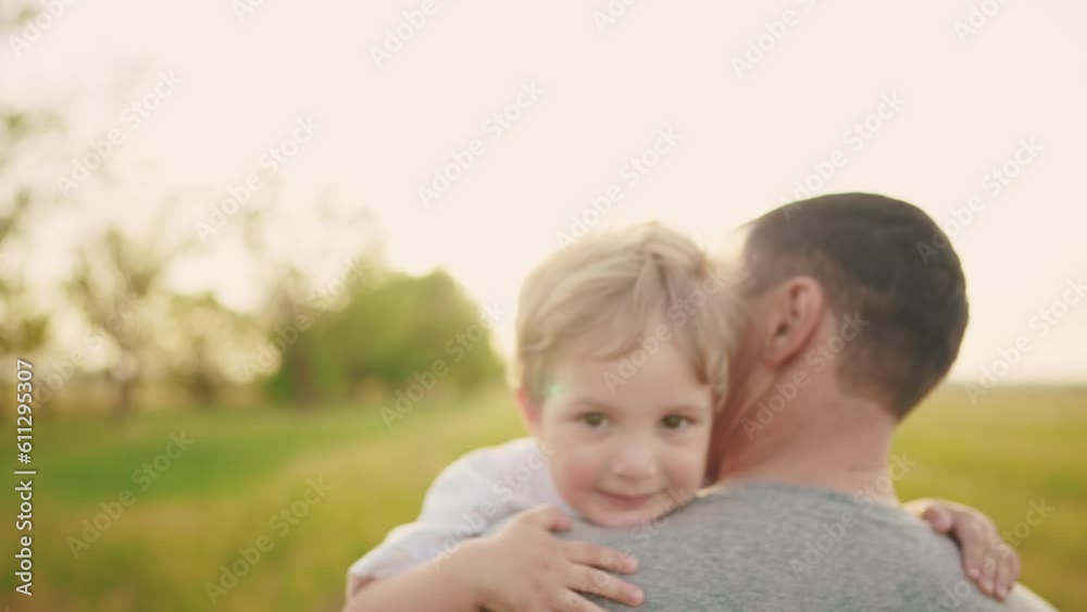 son hugging dad in the park. happy family a father day kid dream concept. baby baby boy walking with dad in nature in his arms. baby hugging dad in lifestyle the park son hugging dad in the park. happy family a father day kid dream concept. baby baby boy walking with dad in nature in his arms. baby hugging dad in lifestyle the park