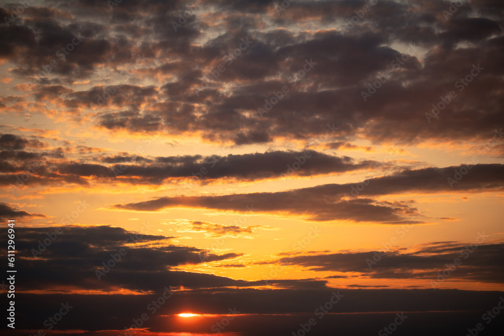 Dramatic Skyline: Sunset Illuminates Clouds or dawn