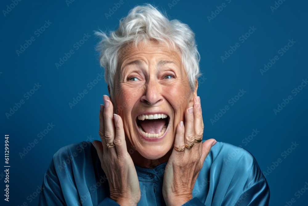 Headshot portrait photography of a joyful mature woman putting hands on the face in a gesture of terror against a sky-blue background. With generative AI technology Headshot portrait photography of a joyful mature woman putting hands on the face in a gesture of terror against a sky-blue background. With generative AI technology