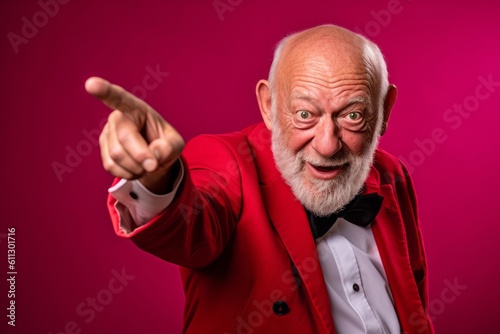 Close-up portrait photography of a grinning old man pointing at oneself with the index finger against a ruby red background. With generative AI technology © Markus Schröder