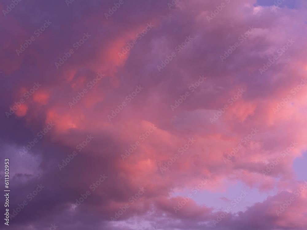 Dramatic sky with clouds. Mysterious abstract background pattern texture. Many blue and magenta tones and patterns of clouds.