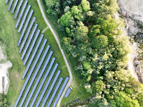 Fototapeta Naklejka Na Ścianę i Meble -  A large-scale solar farm set in a countryside environment