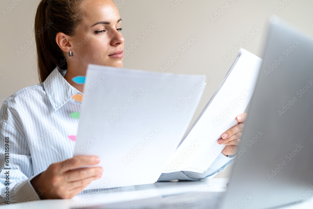 Woman tax inspector conducts tax audit, checking the accounting records. Woman tax inspector conducts tax audit, checking the accounting records.
