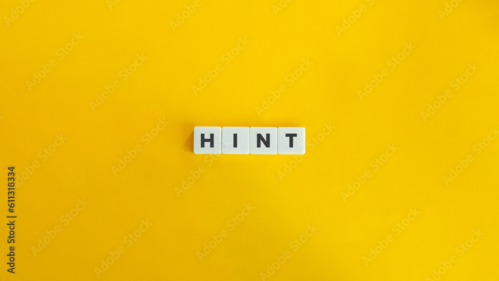 Word Hint on Block Letter Tiles on Yellow Background. Minimal Aesthetic. Word Hint on Block Letter Tiles on Yellow Background. Minimal Aesthetic.