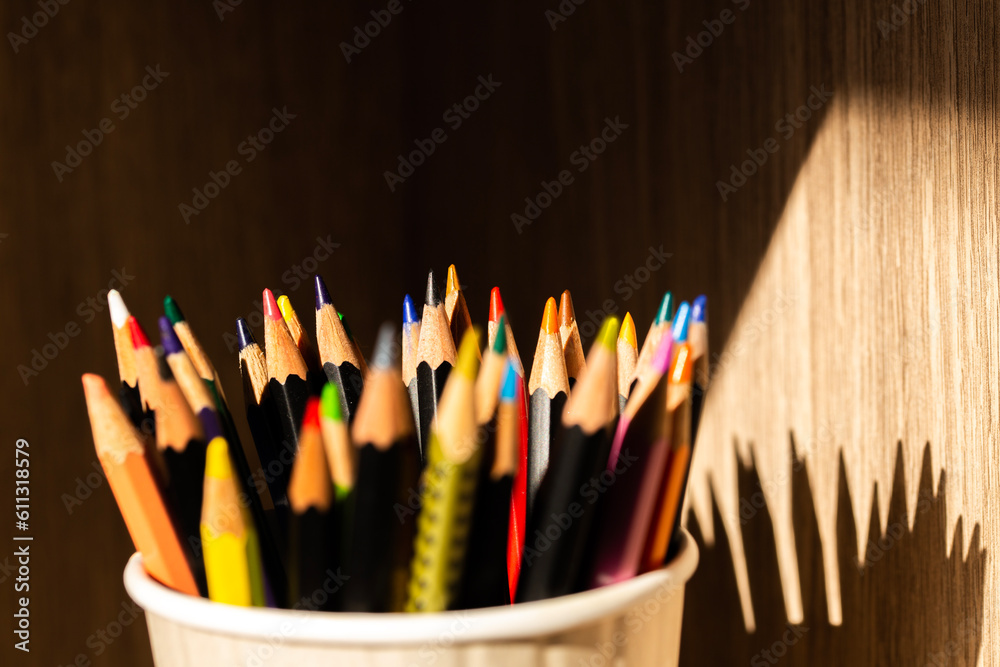 closeup macro shot of color pencils in a cup