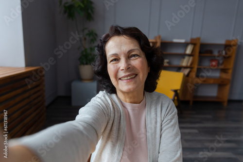 Canvastavla Happy middle aged senior woman talk on video call with friends family