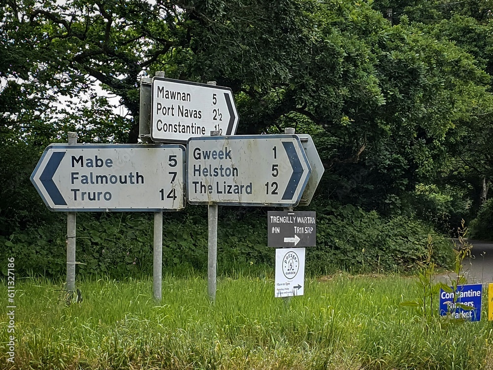 road signs pointing the way to falmouth gweek truro helston mawnan port navas mabe constantine and the lizard in cornwall