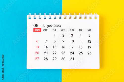 The August 2023 Monthly desk calendar for 2023 year on blue and yellow background.