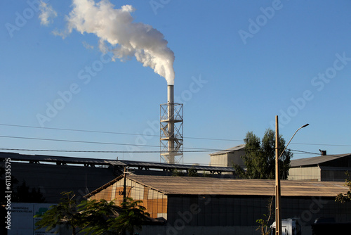luiz eduardo magalhaes, bahia, brazil - june 5, 2023: smoke coming out of a chimney in a silage area in western bahia. photo