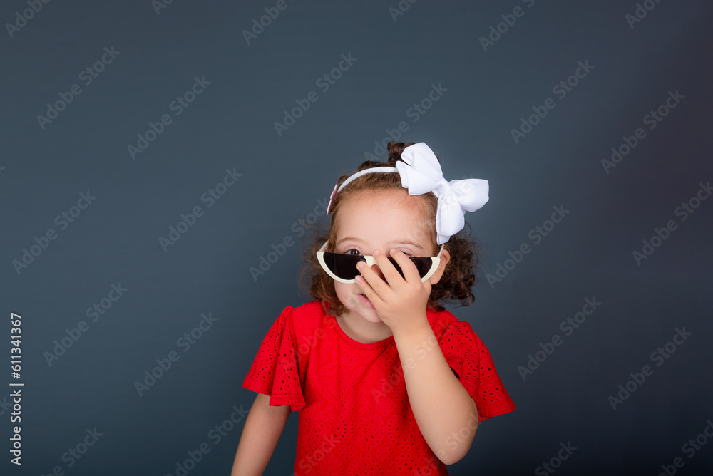 Beautiful happy little girl wearing sunglasses. Beautiful happy little girl wearing sunglasses.