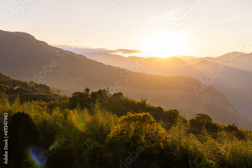Fototapeta Naklejka Na Ścianę i Meble -  Sunset sunlight flare over the mountain