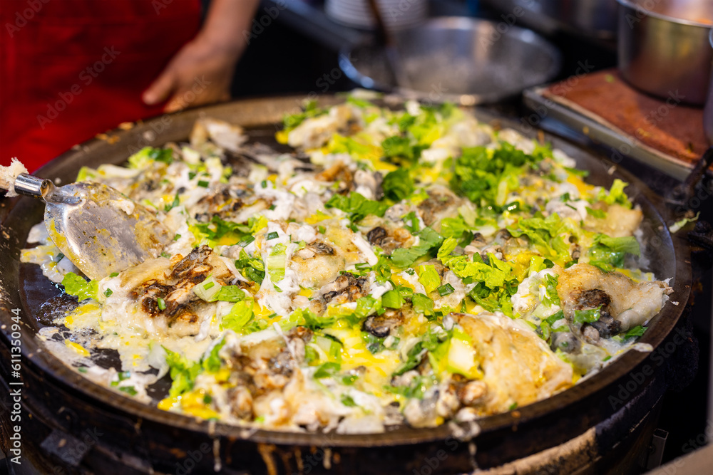 Cooking Taiwan famous Oyster omelette in local food store Cooking Taiwan famous Oyster omelette in local food store