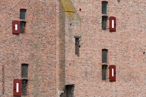 Closeup of the wall with windows of medieval castle Doornenburg in Doornenburg in the Netherlands