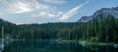 Carezza lake in the dolomites Italy. Lake Karersee with Mount Latemar, Bolzano province, South tyrol, Italy. Landscape of Lake Carezza and Dolomites in background.