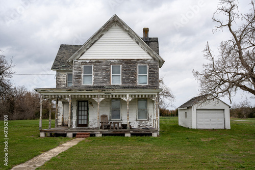 Old victorian farmhouse in decay, decrepitude in need of repair, somewhere in Delaware