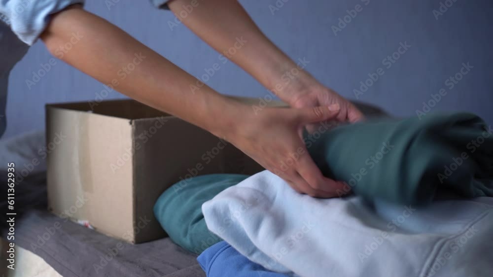Woman donates her clothes. Sale of used clothes. Donation Woman donates her clothes. Sale of used clothes. Donation