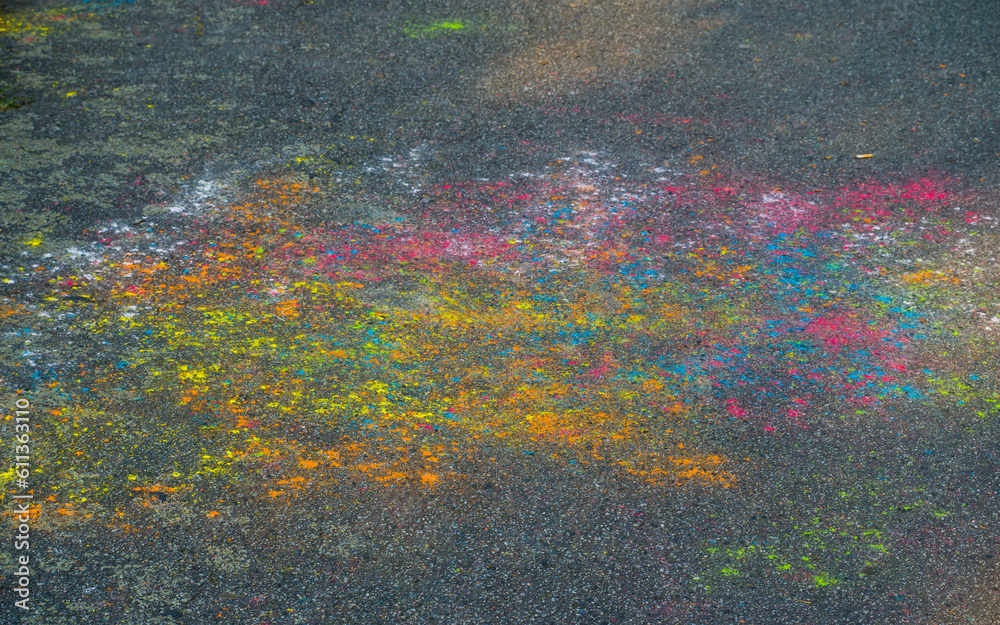 Multicolored pattern in asphalt painted by children