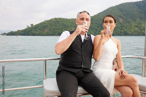 couple drinking fruit juice in luxury yacht © offsuperphoto