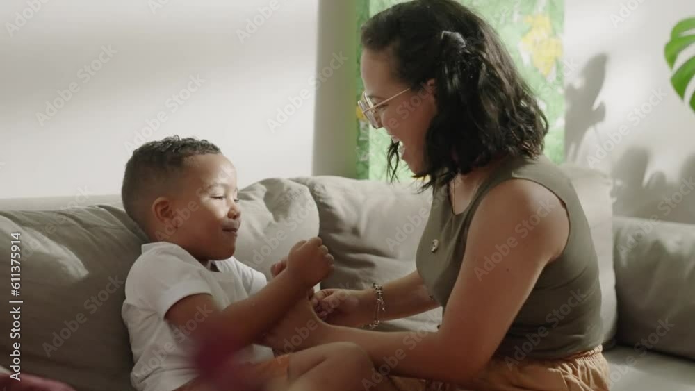 Adorable little kid son playing patty cake with latina mom at home. Happy mixed race family mother and cute little boy son learning funny game having fun enjoying sweet moments together.
Adorable little kid son playing patty cake with latina mom at home. Happy mixed race family mother and cute little boy son learning funny game having fun enjoying sweet moments together.