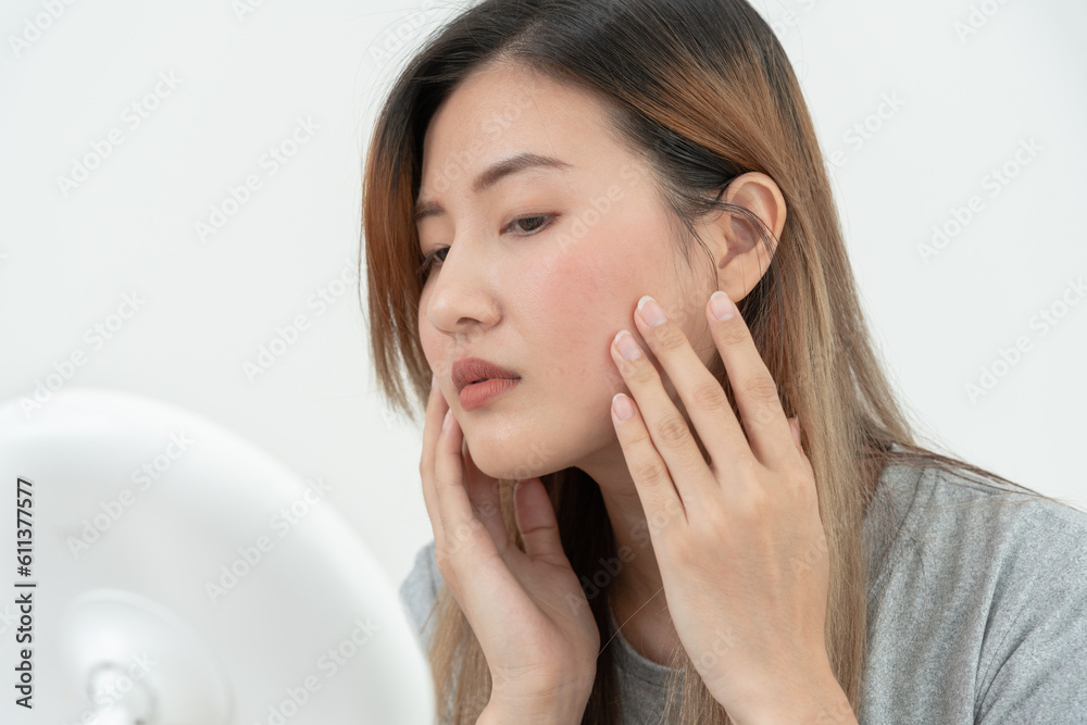 Young woman asian are worried about faces Dermatology and allergic to steroids in cosmetics. sensitive skin, red face from sunburn, acne, allergic to chemicals, rash on face. skin problems and beauty Young woman asian are worried about faces Dermatology and allergic to steroids in cosmetics. sensitive skin, red face from sunburn, acne, allergic to chemicals, rash on face. skin problems and beauty