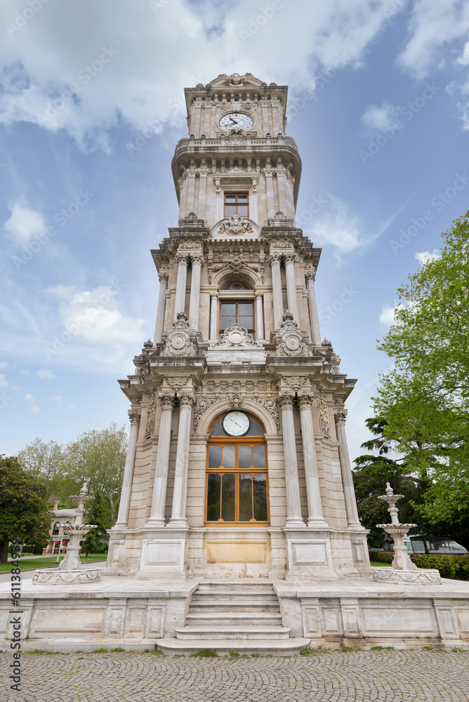 Day shot of Dolmabahce Clock Tower, Turkish: Dolmabahce Saat Kulesi, situated outside Dolmabahce Palace, Istanbul, Turkey, in a spring day