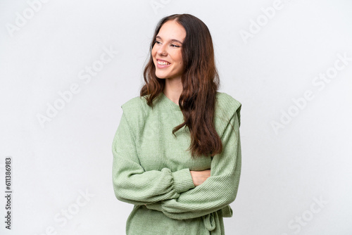 Young caucasian woman isolated on white background with arms crossed and happy