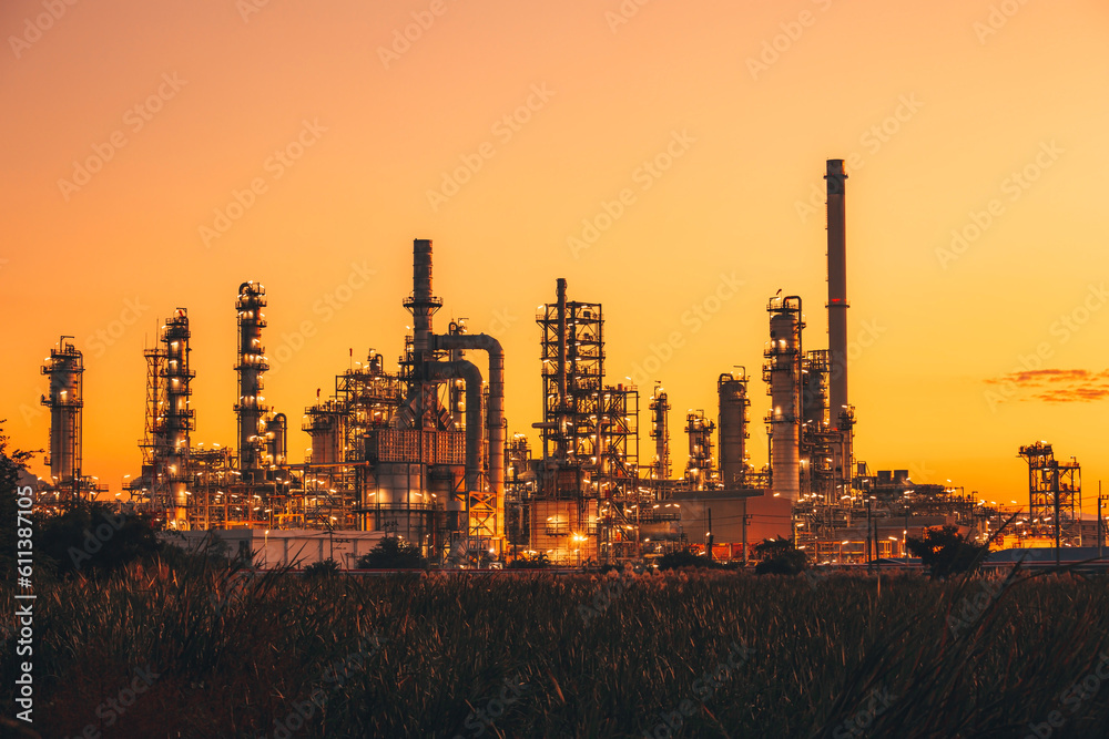 Fototapeta premium Scene of the oil refinery plant of petrochemistry Oil​ refinery​ and​ plant and flue smoke industry in oil​ and​ gas​ ​industry with​ cloud​ red and orange ​sky the morning​