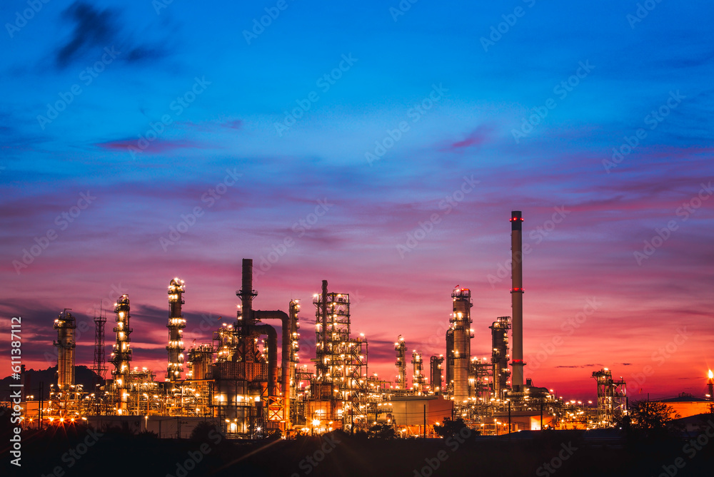 Scene of the oil refinery plant of petrochemistry Oil​ refinery​ and​ plant and flue smoke industry in oil​ and​ gas​ ​industry with​ cloud​ red and orange ​sky the morning​