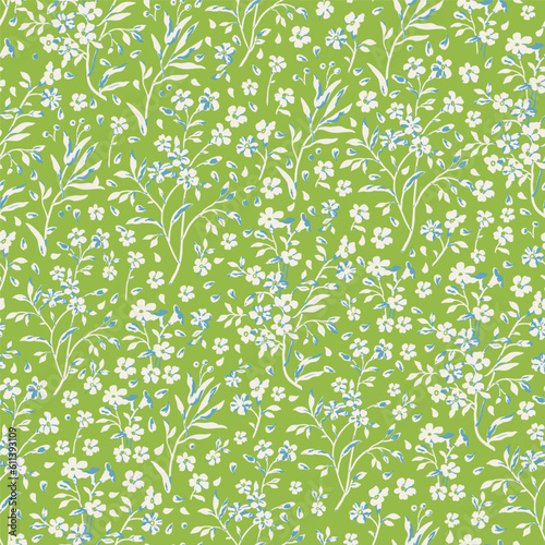 Seamless floral pattern for design. Small white flowers. Green background. Modern floral texture. Floral pattern all over the body. An elegant template for fashionable prints.