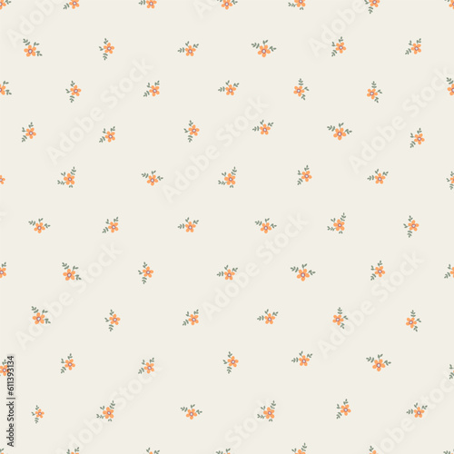Vintage pattern of small orange flowers and green leaves on a light background