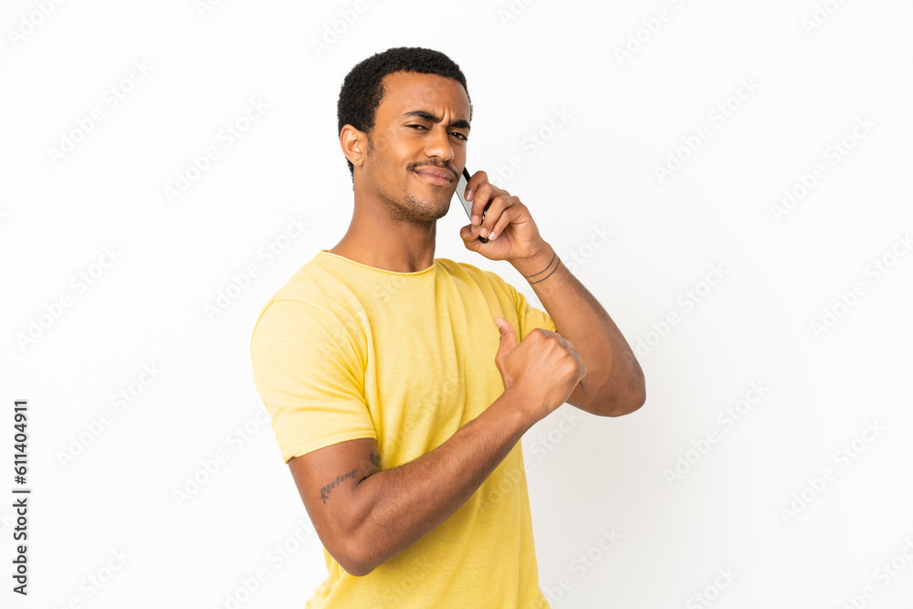 African American handsome man using mobile phone over isolated white background proud and self-satisfied African American handsome man using mobile phone over isolated white background proud and self-satisfied