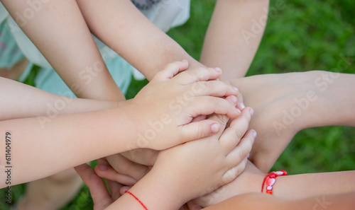 children, friends are playing in the garden, holding hands.