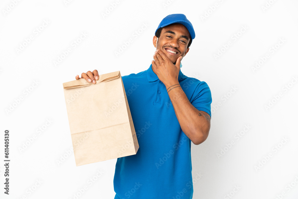 African American man taking a bag of takeaway food isolated on white background happy and smiling African American man taking a bag of takeaway food isolated on white background happy and smiling