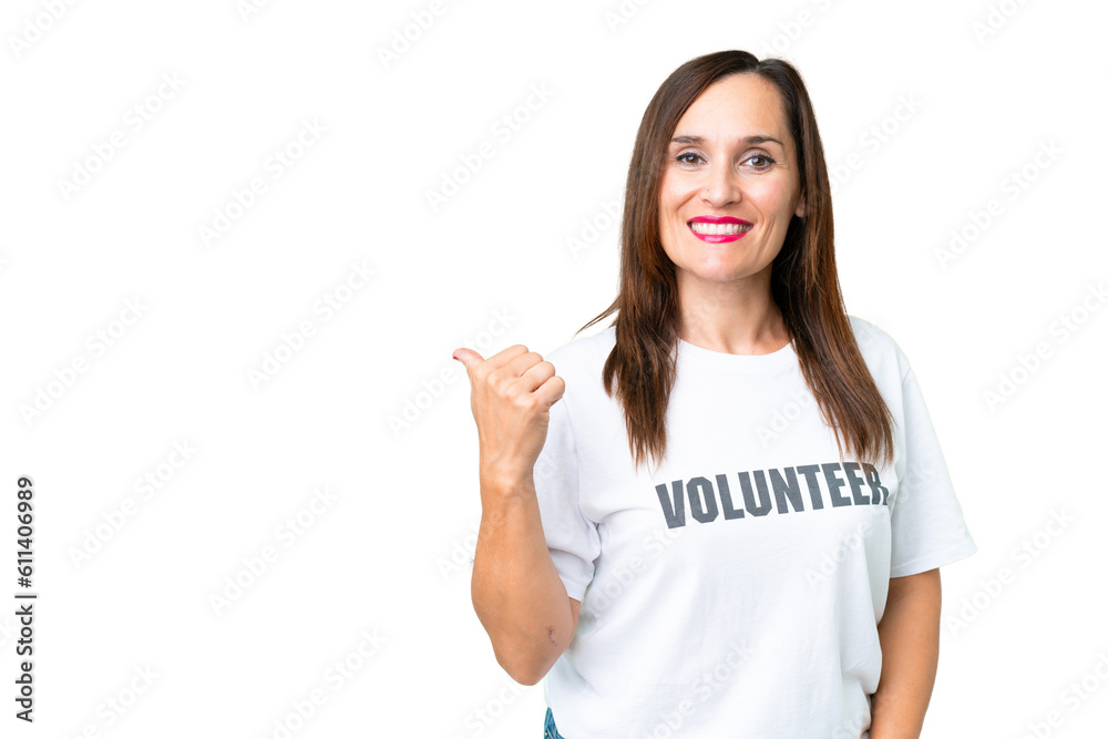 Middle age volunteer woman over isolated chroma key background pointing to the side to present a product Middle age volunteer woman over isolated chroma key background pointing to the side to present a product