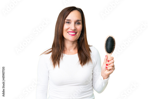 Middle age woman with hair comb over isolated chroma key background smiling a lot