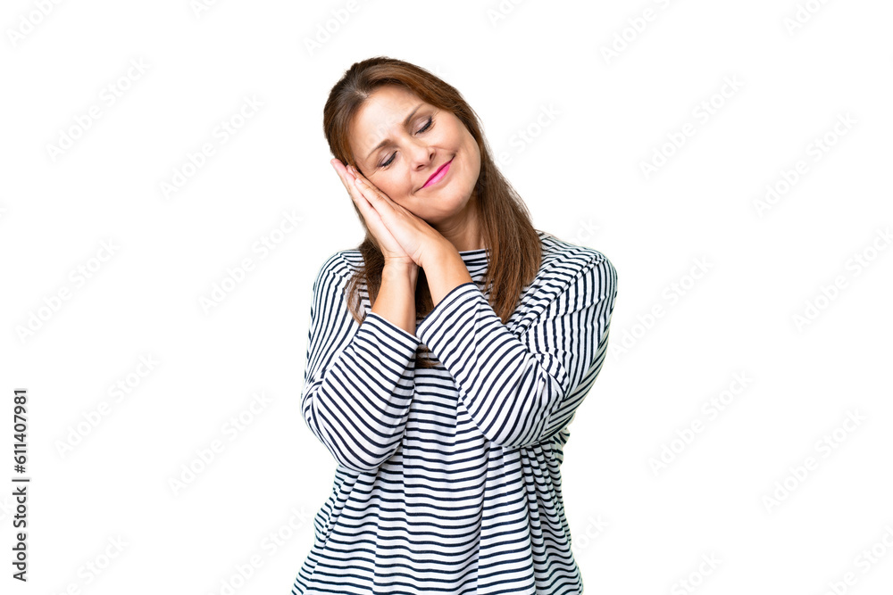 Middle age woman over isolated background making sleep gesture in dorable expression Middle age woman over isolated background making sleep gesture in dorable expression