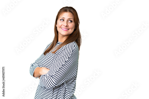 Middle age woman over isolated background with arms crossed and happy