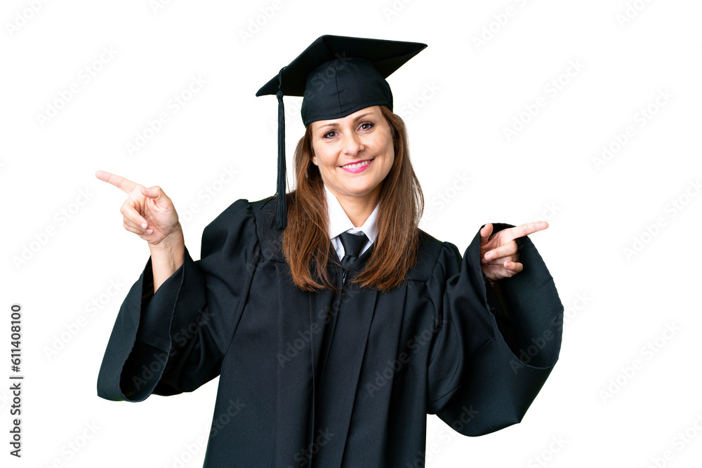 Middle age university graduate woman over isolated background pointing finger to the laterals and happy Middle age university graduate woman over isolated background pointing finger to the laterals and happy