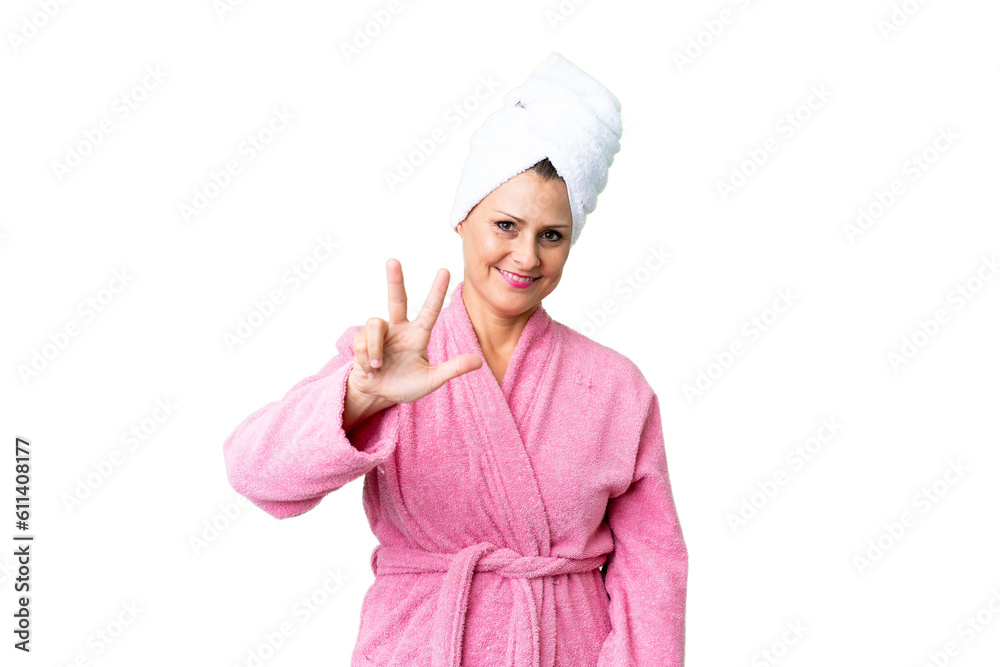 Middle age caucasian woman in a bathrobe over isolated background happy and counting three with fingers Middle age caucasian woman in a bathrobe over isolated background happy and counting three with fingers
