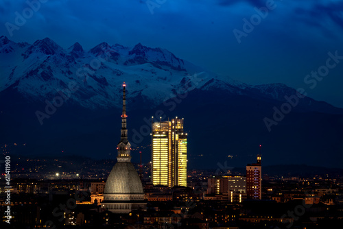 The Mole Antonelliana and the SanPaolo Skyscraper in a nightscape above Turin. photo