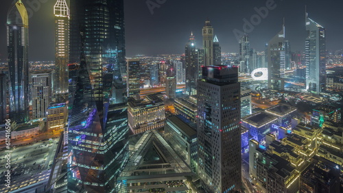 Panorama showing futuristic skyscrapers in financial district business center in Dubai night timelapse