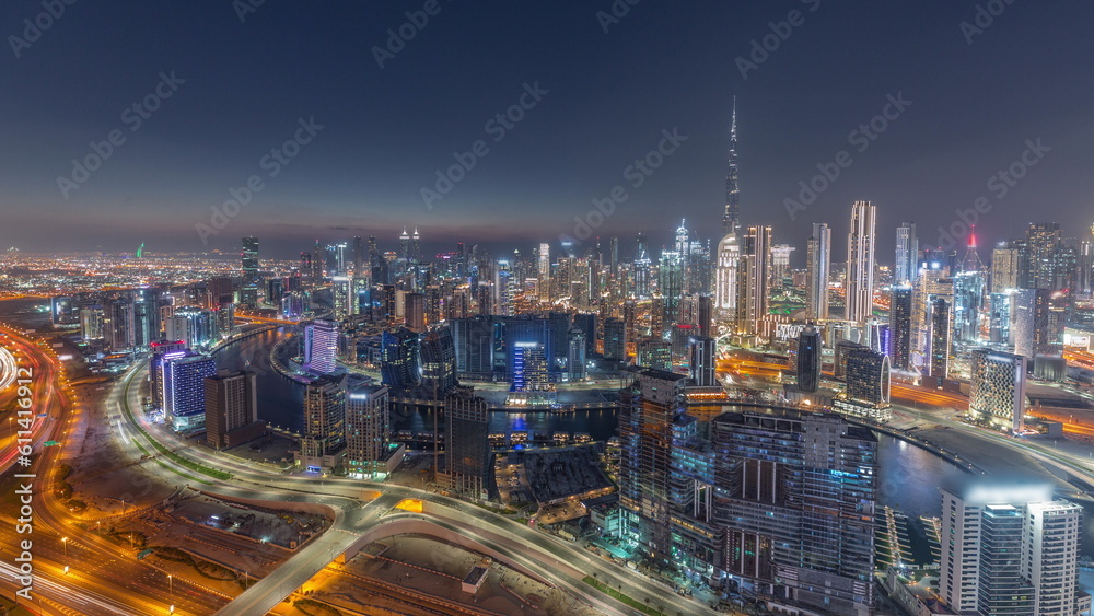 Skyline with modern architecture of Dubai business bay towers day to night timelapse. Aerial view Skyline with modern architecture of Dubai business bay towers day to night timelapse. Aerial view