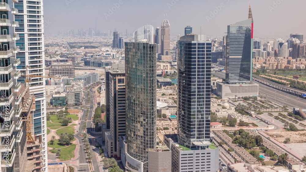 Obraz premium Aerial view of media city and al barsha heights district area all day timelapse from Dubai marina.
