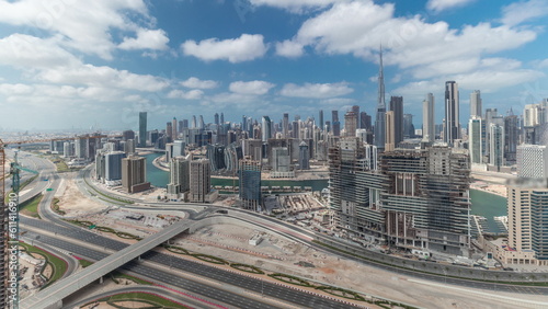 Panorama showing skyline of Dubai with business bay and downtown district timelapse. photo