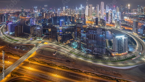 Panorama showing skyline of Dubai with business bay and downtown district night timelapse.