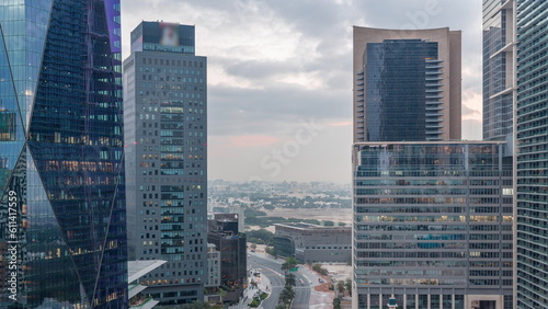 Dubai International Financial district aerial night to day timelapse. View of business office towers.