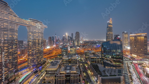 Futuristic Dubai Downtown and finansial district skyline aerial day to night timelapse.