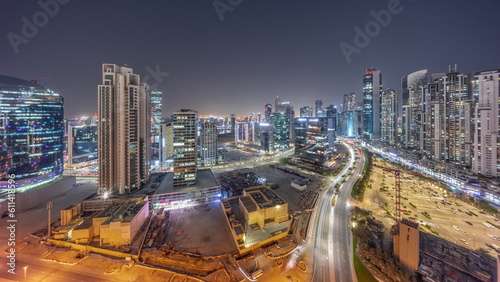Business Bay with modern towers residential development aerial panoramic day to night timelapse  Dubai