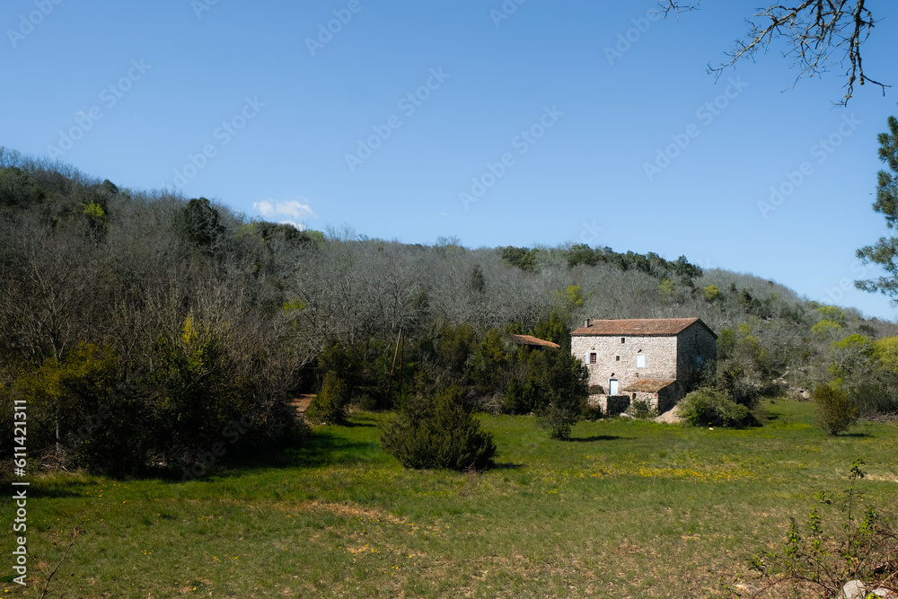 An old two-story house in the Provencal style. A lot of space. Alone in the forest. Tourist route. Balazuc, Ardèche department, France.